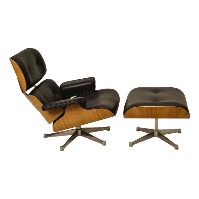 Set of Lounge Chair and Ottoman in Walnut and Black Leather by Charles Eames for Herman Miller, 1990s For Sale