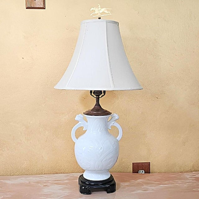 An exquisite Neoclassical porcelain urn lamp by Wildwood, handcrafted in Rocky Mount, North Carolina, showcasing refined...