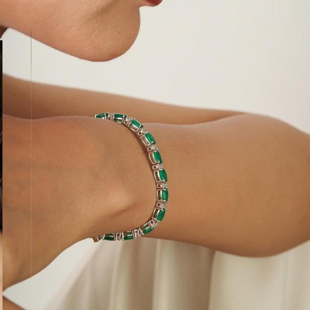 A refined green onyx and cubic zirconia tennis bracelet crafted in 925 sterling silver, offering a balanced interplay of...