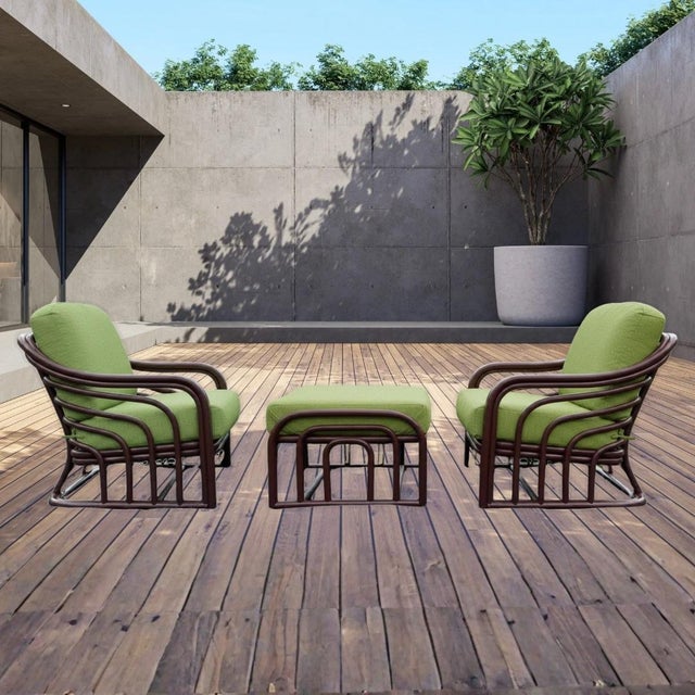 1960s Brown Jordan bent rattan chairs and ottoman. This listing is for three pieces of designer furniture: two (2) chairs...