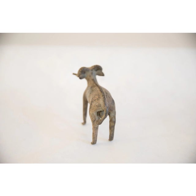 :: Vintage handmade African imperfect ram with leaf sculpture. Circa late mid 20th century, though possibly older, this...