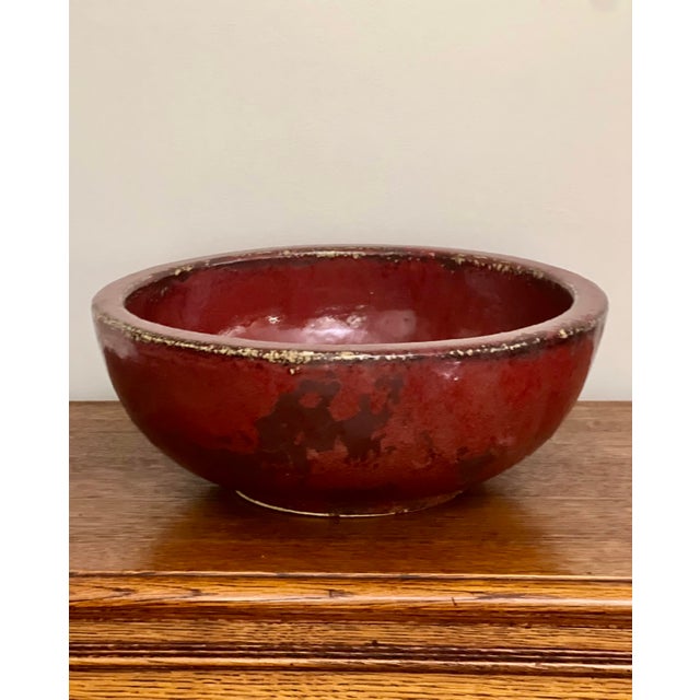 Large patinated Chinese Sang de Boeuf with Flambe glazed bowl, signed, early 20th century. A heavy, thick-bodied...