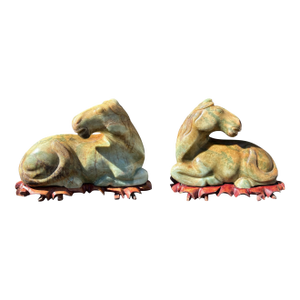 Late 20th Century Carved Hardstone Reclining Horse Sculptures on Organic Wood Bases - a Pair