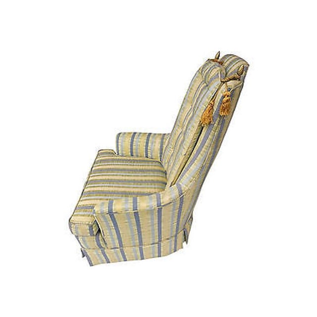 Vintage Modern American tasselled chair with soft colors striped upholstery, button-tufting, and mahogany legs....