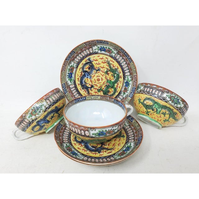 Here are three vintage famille rose cup and saucer sets made in China. The intricate details of these pieces include blue...