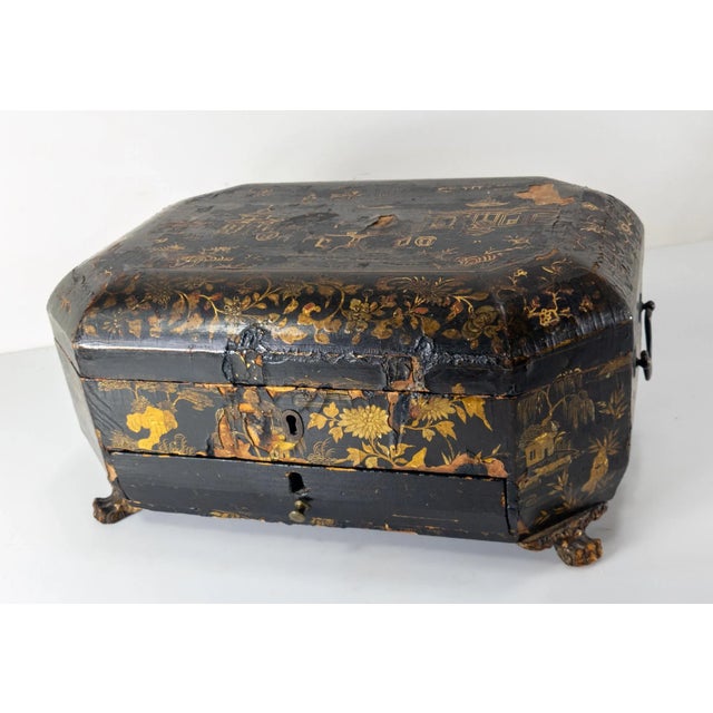 We are selling this nice 19th century Japanese or Chinese gold lacquered black sewing box with some interior parts,...