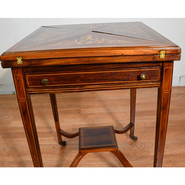 We are pleased to offer this Beautiful Antique English Hepplewhite Envelope game table, from the 1900. This table is made...