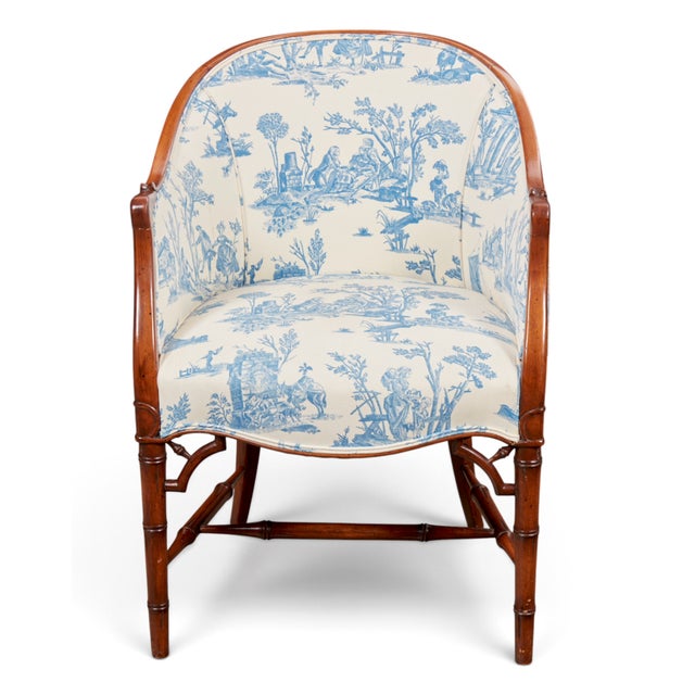 Blue & Cream Toile Faux Bamboo Walnut Bergère Chair, Georgian Style, Mid-20th Century An elegant walnut frame, sculptural...