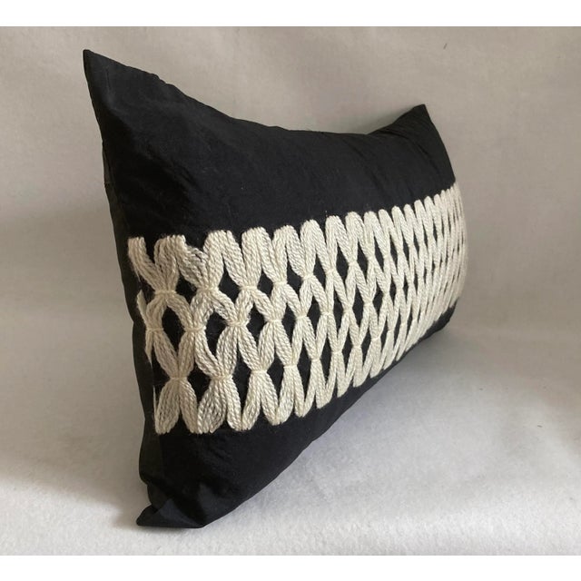 A modern craft handwork lumbar pillow. A distinct ivory trellis embroidery in wool mohair contrasted on a sleek smooth...