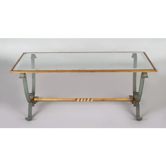 French vintage wrought iron and glass coffee table, the gilded rectangular frame inset with a glass top that has a 1.5...