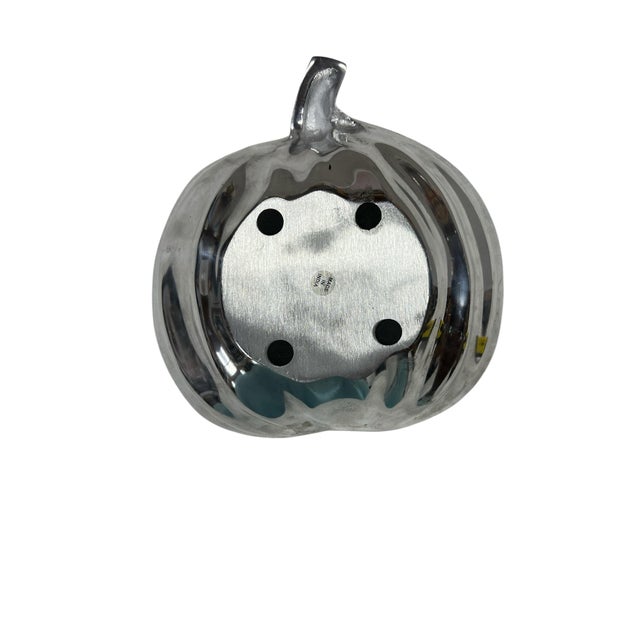 Metal decorative pumpkin bowl. Great for packaged snacks, etc. Measures 9” w x 9” d x 3” h. Made in India.