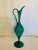 This stunning teal over white glass pitcher has beautiful lines that are accentuated by the large scale of the piece,...