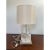 This is a natural polished quartz lamp by Jacques Garcia for Baker Furniture, it has a silver base with a switch on the...