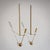 Set of four lancet-shaped wall-mounted candle holders in brass, combining a minimalist yet refined design language....