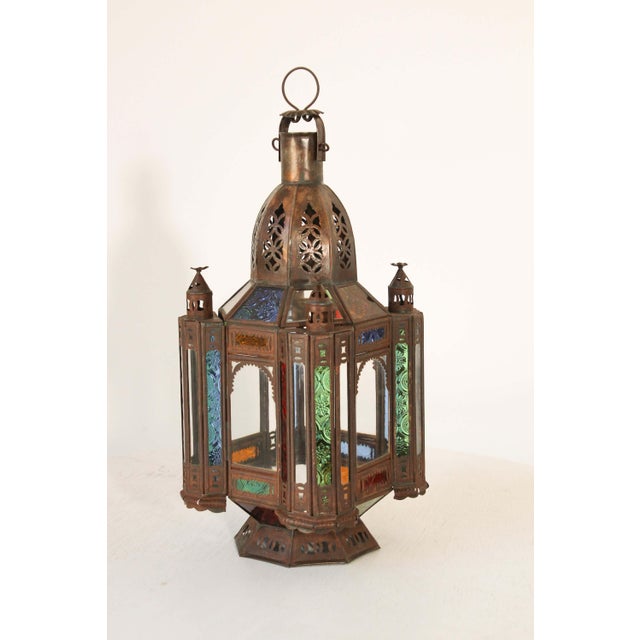 Handcrafted vintage Moroccan tole metal glass lantern or Moorish pendant. Moorish style North African lantern with multi-...