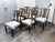 Design Plus Gallery presents a Set of Six Duncan Phyfe Dining Room Chairs. The set is complete for a family dining area...