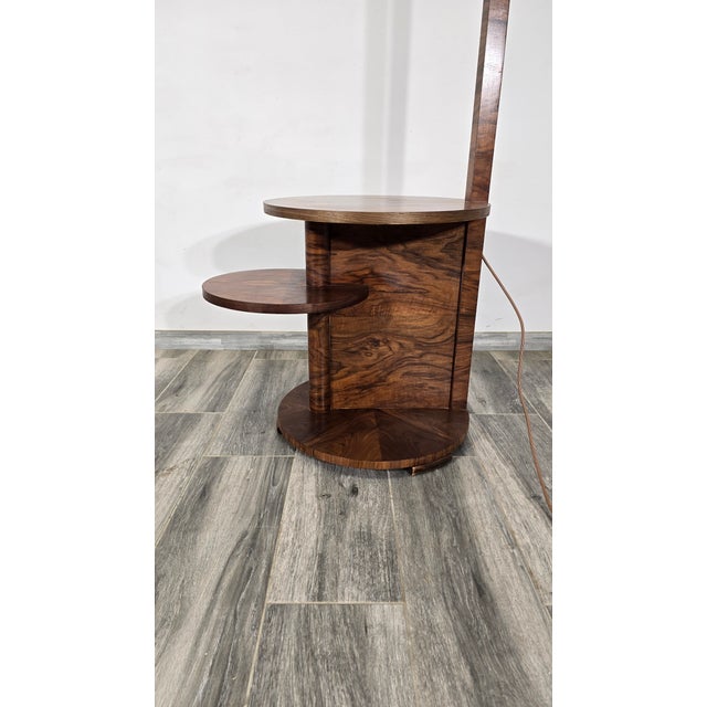 Art Deco Floor Lamp in Wood, in Good conditions. Designed 1920 to 1949 European Plug (up to 250V).The wiring of this item...
