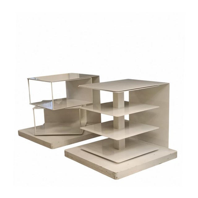 P. Tolomeo Swivel Bookcase, a vertical bookcase-bedside table-coffee table that swivels 360°. It has a white lacquered...