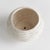 With a reactive glaze and hand finished ribbing detail, this charming pot is a great find. Plant your favorite lush greens...