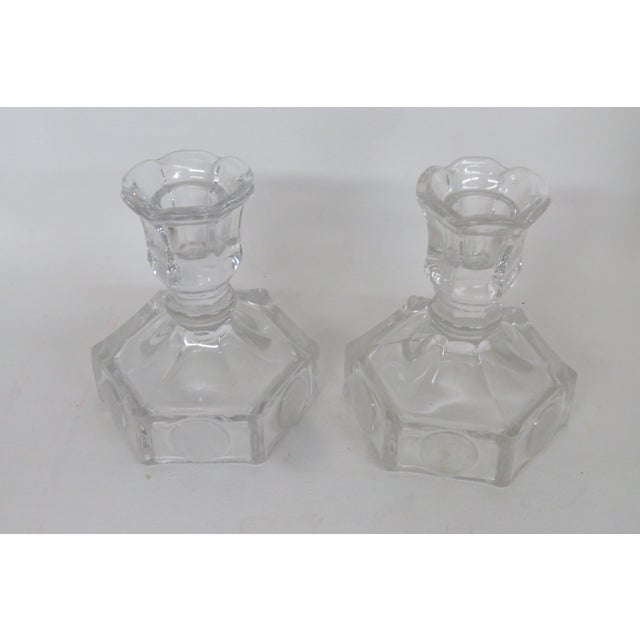 This lovely pair of Candle Holders is made of glass. This pair is made in the famous frosted Coin pattern by fine...