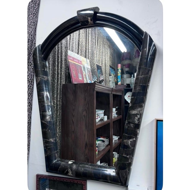 Make a dramatic statement with this exceptional vintage Hollywood Regency wall mirror featuring a sculptural arched...
