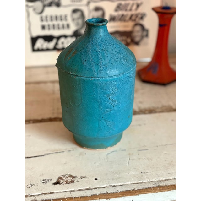 This is an antique 1960s modern turquoise stoneware vase, signed and stamped and in pristine condition. The signature...