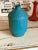This is an antique 1960s modern turquoise stoneware vase, signed and stamped and in pristine condition. The signature...