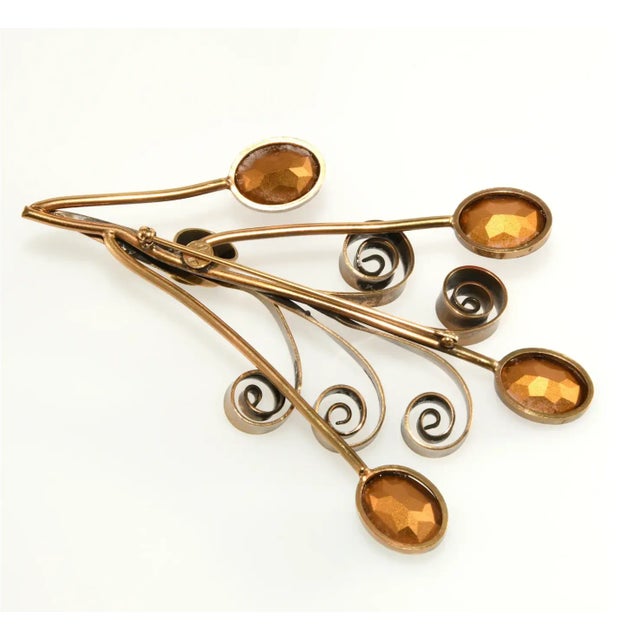 This is part of Chairish’s Costume Jewelry assortment. Huge floral spray brooch with jewel toned unfoiled rhinestones in...