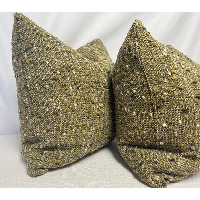 Custom pair of 22" pillows covered in Donghia "Knots Landing" in color artichoke woven fabric. These pillows have tapered...