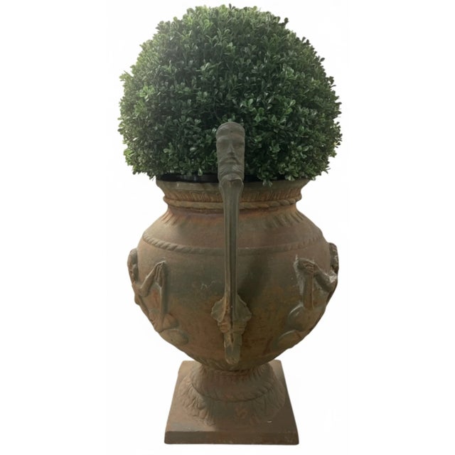 This pair of antique English cast iron urn planters will bring a sense of classical elegance and historical charm to any...