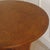 Round oak coffee table, made around 1940 in Germany. The clearly proportioned round top above the tapered cross base...