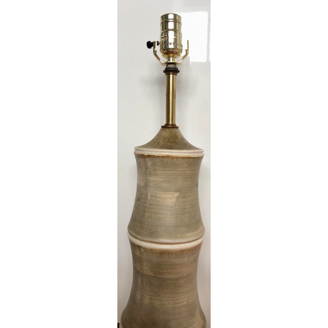 Stunning mid-century modern table lamp wrapped in faux parchment.