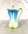 This is an unmarked Chocolate pot. It is teal at the top which fades to white with a light mint green raised leaf design...