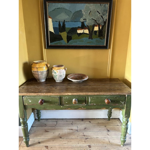Beautiful old pine prep table with planked top with 3 drawers. It has a wonderful chippy painted patina. HIt has many age...