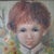 I recognized this artist's work right away, even from a distance. This touching portrait is painted on a fabric that is...