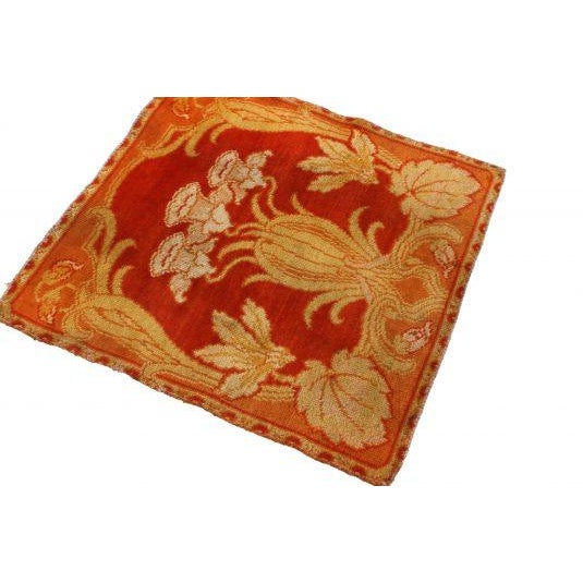 Hand knotted with luminous silk in a near-perfect square body, this antique floral rug originates from the United States...
