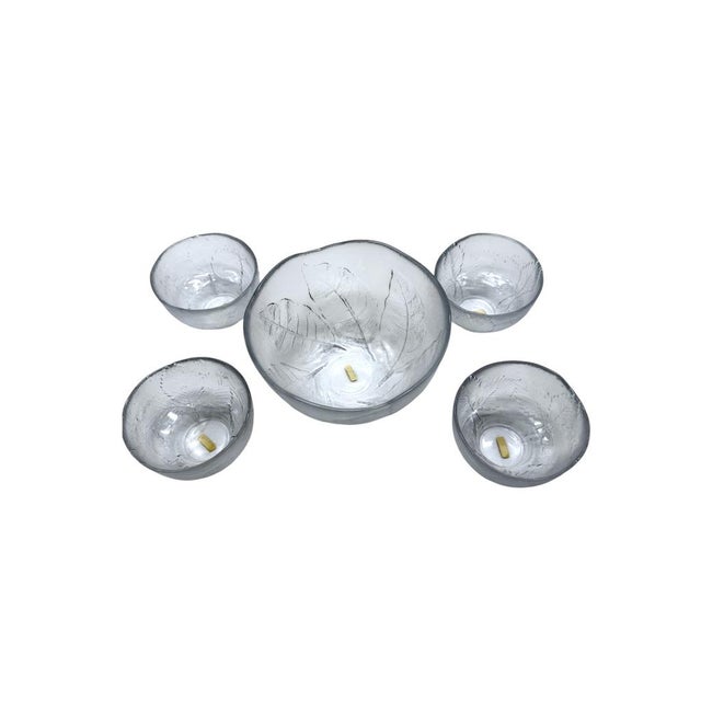 This is a vintage Kosta Boda "Party" glass bowl set designed by Ann and Göran Wärff in 1975. Elegantly crafted glass bowls...