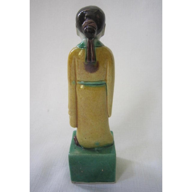 Porcelain polychrome Chinese immortal figure. Standing on a draped pedestal. Very good coloring and good casting. The size...