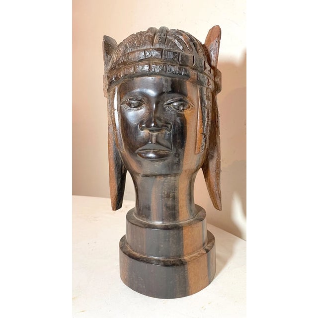 Up for sale is a nice quality antique hand carved African wooden sculpture. This exquisite example is carved out of a very...