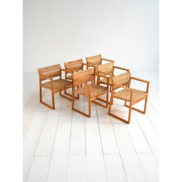 Set of six solid oak chairs with armrests and woven cane seat and backrest. Børge mogensen, lauritsen, 1957, model "bm62"....