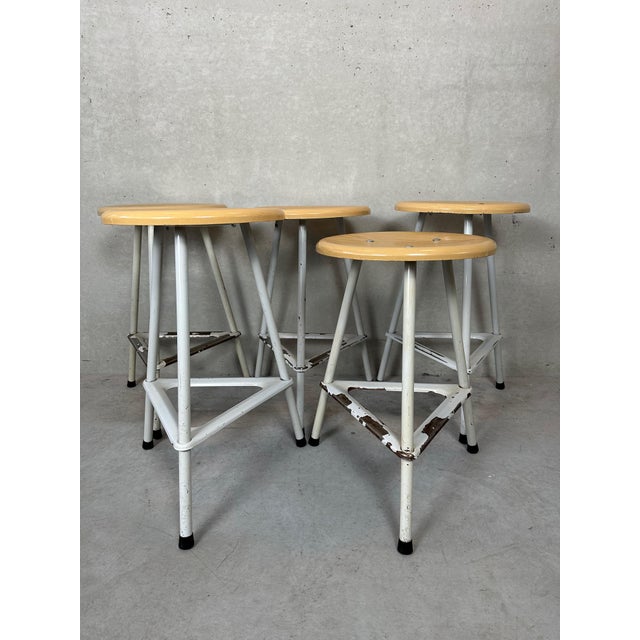 Nice set of 5 school/lab stools. Sturdy metal structure. Seat in hard PVC. Marked. Has signs of use and age, but is...