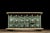 Primitive cabinet with pronounced molding likely manufactured around the turn of the century by a craftsman for use in...