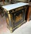 Make a sophisticated statement with this French Louis XVI-inspired commode, featuring a rich black wood finish, elegant...