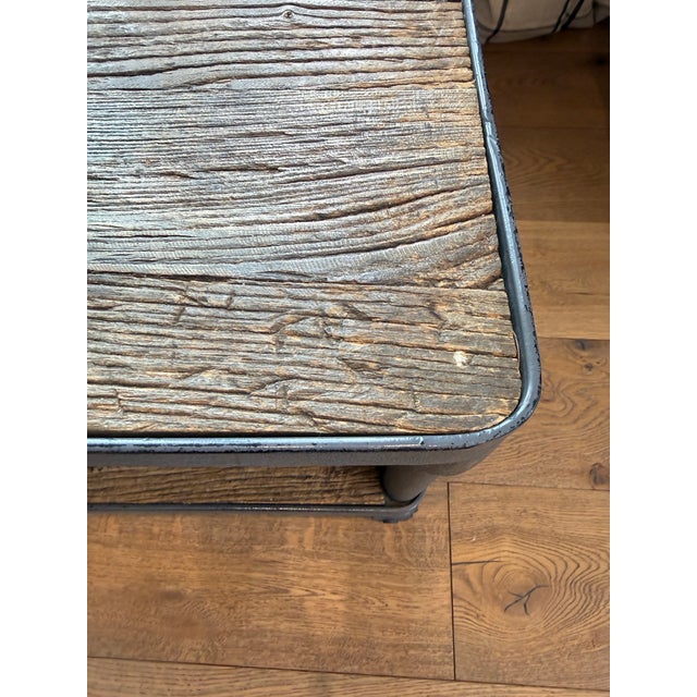 Industrial style coffee table from Restoration Hardware. Silver birch barnwood top and shelf with heavy metal legs and...