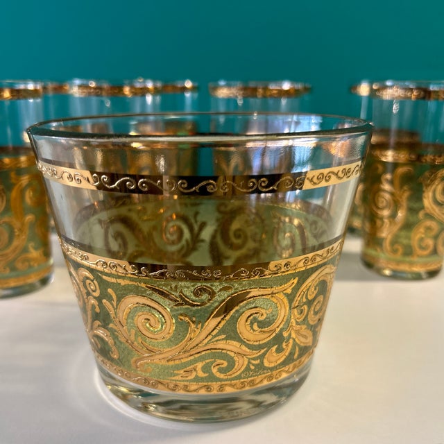 Culver Ltd cocktail set of 8 highball glasses and matching ice bucket. They have a textured applied gold design on them...