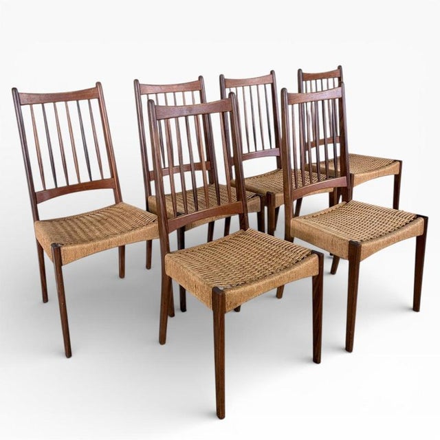 A beautifully proportioned set of six danish dining chairs, designed by arne hovmand‑olsen and known as model mk200. These...