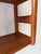 Mid-century wall rack produced by the Danish firm Dyrlund in the 1960s. The design stands out due to the open sides of...