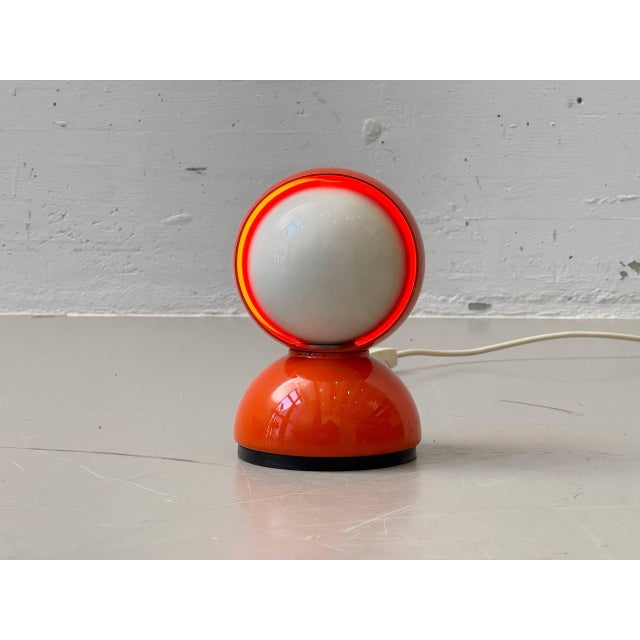 The iconic eclisse table lamp, designed in 1965 by vico magistretti for artemide, is one of the most famous italian design...