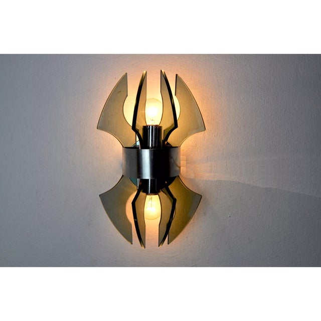 Beautiful and rare Veca wall lamp produced in Italy in the 70s. Wall lamp made of Murano glass crystals. Chromed metal...