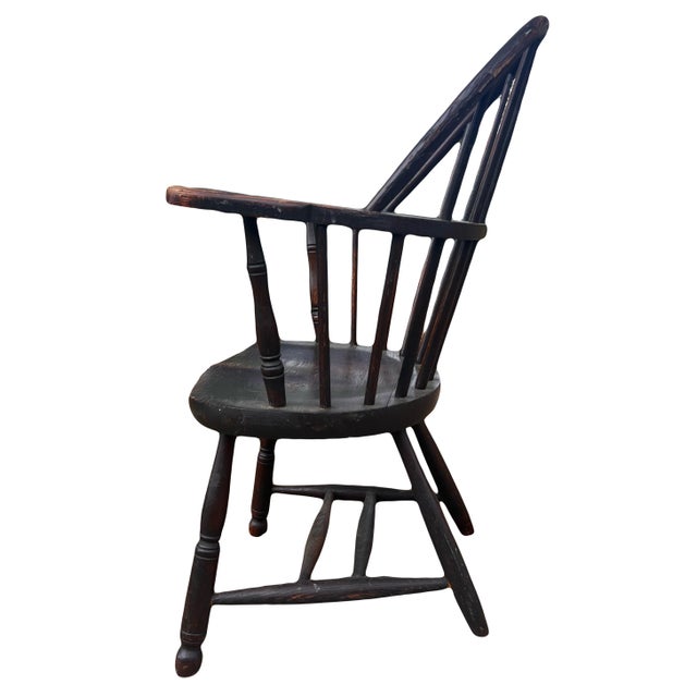 A very finely preserved late 19th-early 20th century firehouse sack back Windsor armchair with original brown paint. This...